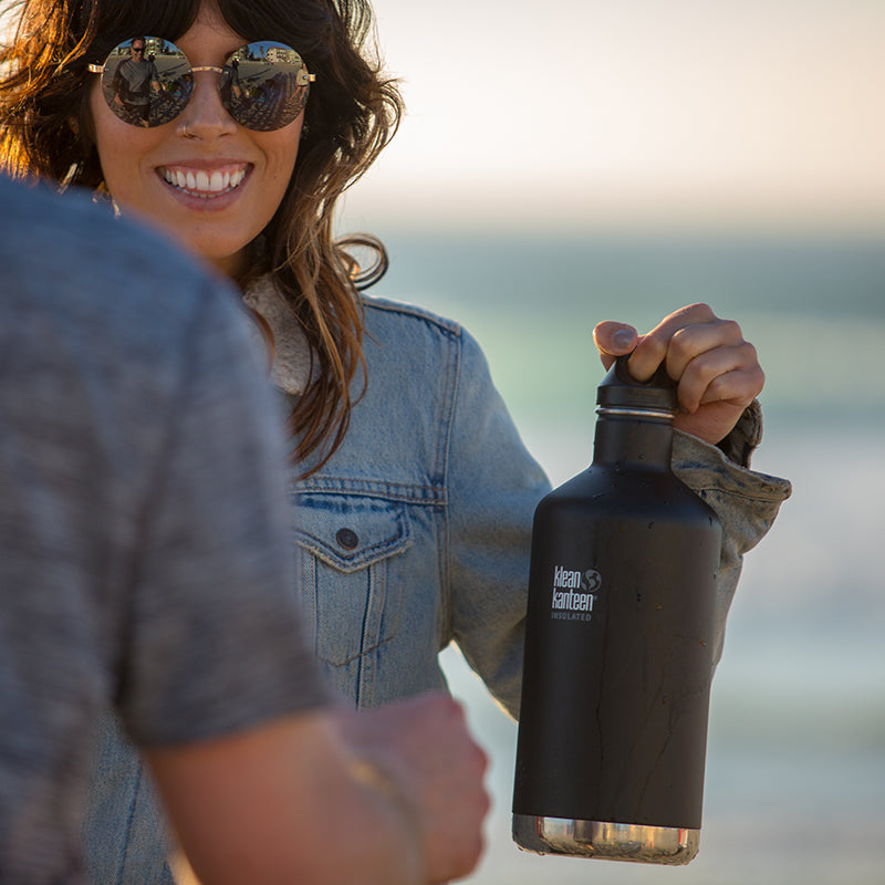 64oz-classic-with-loop-cap-n4 64oz_insulated_classic_black_beach_girl_hand_square.jpg
