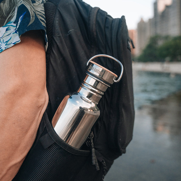 27oz-reflect-with-bamboo-cap-u0 K27SSLRF-MS-BAMBOO_reflect-bottle_backpack_lifestyle.jpg